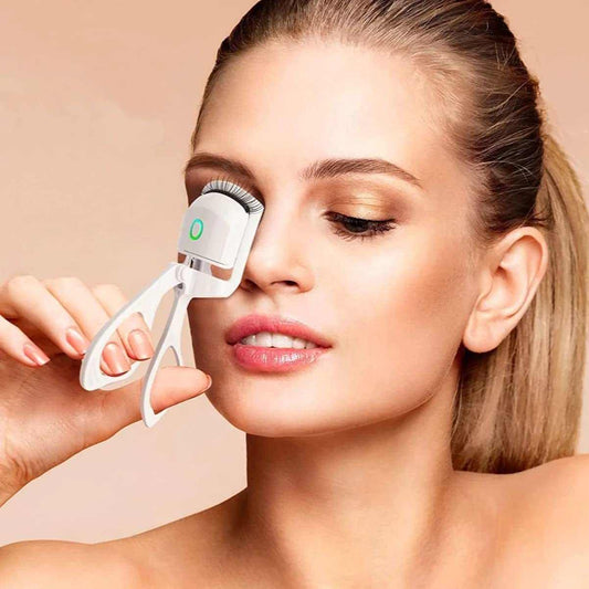 Recourbe-cils chauffant ergonomique pour des cils courbés et volumineux en douceur